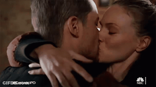 Man And Woman Kissing In Room GIF