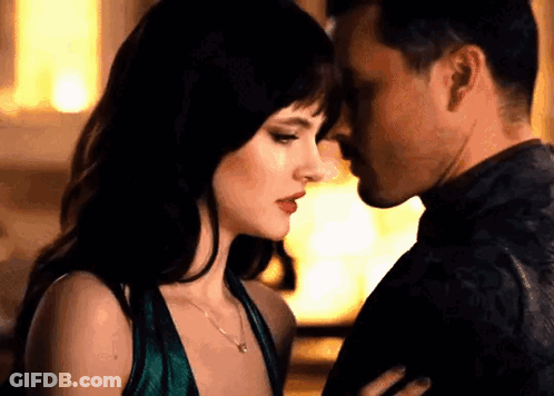 Man And Woman Kissing In Room GIF