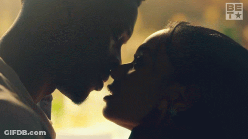 Man And Woman Kissing In Room GIF