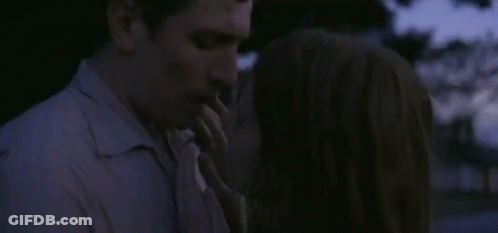 Man And Woman Kissing In The Dark GIF