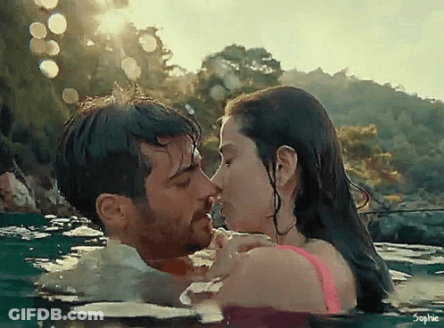 Man And Woman Kissing In Water GIF