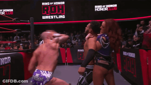 Man And Woman Kissing In Wrestling Ring GIF