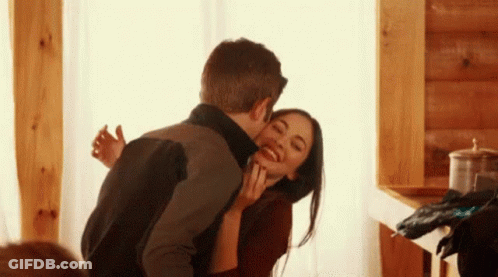 Man And Woman Kissing GIF
