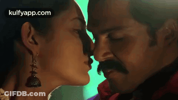 Man And Woman Kissing GIF