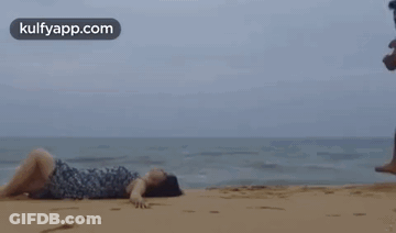 Man And Woman Kissing On Beach GIF