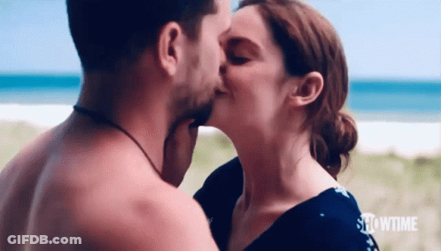 Man And Woman Kissing On Beach GIF