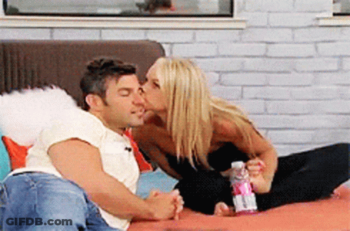 Man And Woman Kissing On Bed GIF