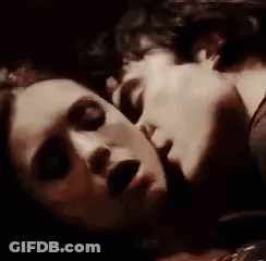 Man And Woman Kissing On Bed GIF