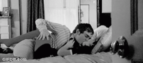 Man And Woman Kissing On Bed GIF
