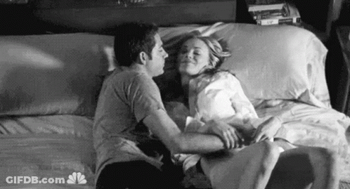 Man And Woman Kissing On Bed GIF