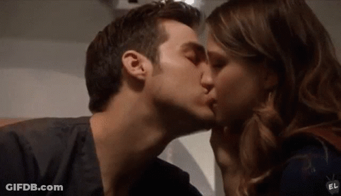 Man And Woman Kissing On Cheek GIF