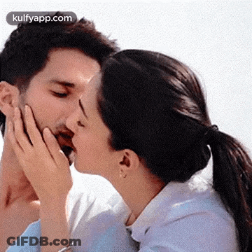 Man And Woman Kissing On Cheeks GIF