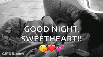 Man And Woman Kissing On Couch Saying Good Night Sweetheart GIF