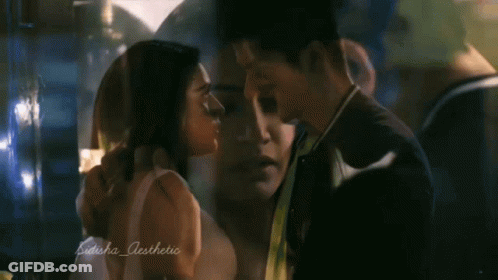 Man And Woman Kissing GIF