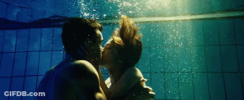 Man And Woman Kissing Underwater GIF