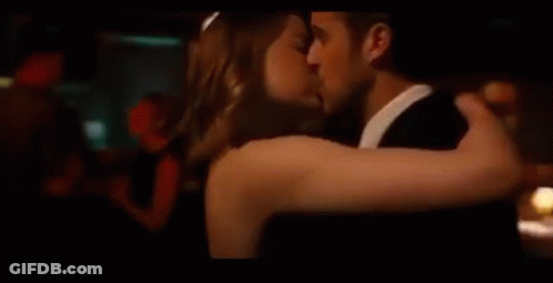 Man And Woman Kissing While Dancing In Club GIF