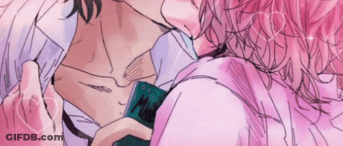 Man And Woman Kissing While Holding Phone GIF
