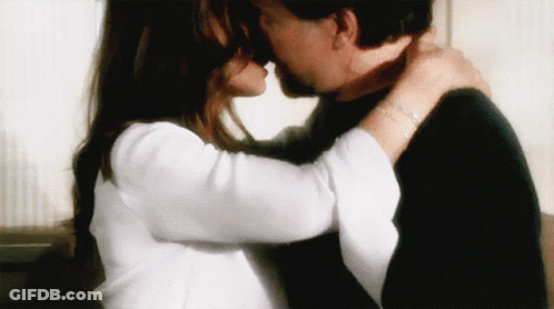 Man And Woman Kissing With Bracelet GIF