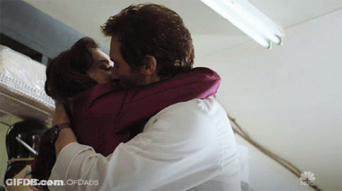 Man And Woman Kissing With Council Of Dads GIF