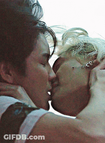 Man And Woman Kissing With Earrings GIF