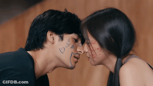 Man And Woman Kissing With Hearts And Stars On Faces GIF