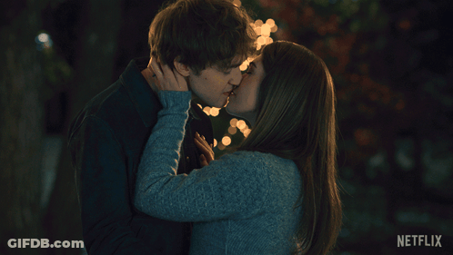 Man And Woman Kissing With Netflix Logo GIF
