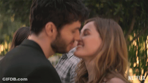 Man And Woman Kissing With Netflix Logo GIF