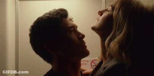 Man And Woman Kissing With No Smoking Sign GIF