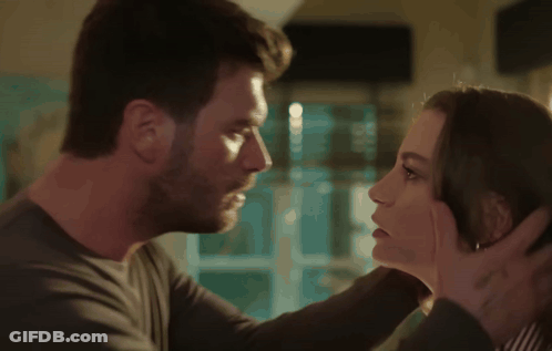 Man And Woman Kissing With Tattoo On Hand GIF