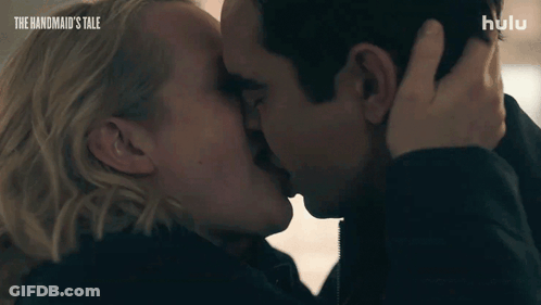 Man And Woman Kissing With The Handmaid's Tale GIF