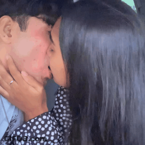Man And Woman Kissing Woman In Polka Dot Dress GIF