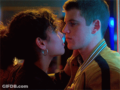 Man And Woman Kissing Woman Wearing Earrings GIF