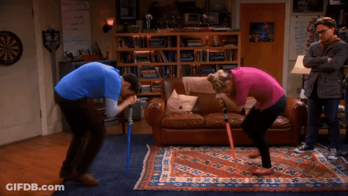 Man And Woman Kneeling In Front Of Couch GIF