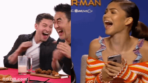 Man And Woman Laughing At R-Man Coming Sign GIF