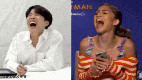 Man And Woman Laughing Woman Holding Cell Phone GIF