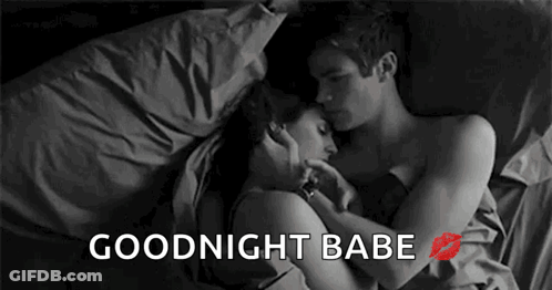 Man And Woman Laying In Bed Hugging And Kissing GIF