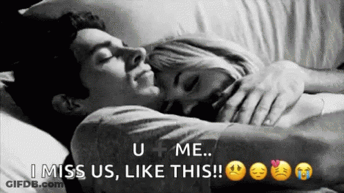 Man And Woman Laying In Bed Hugging GIF
