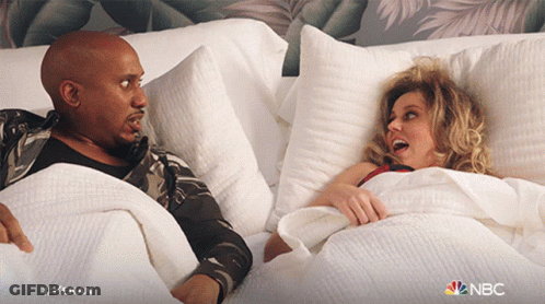 Man And Woman Laying In Bed With NBC Logo GIF
