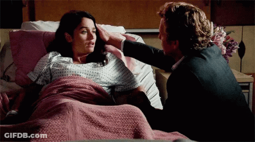 Man And Woman Laying In Hospital Bed GIF