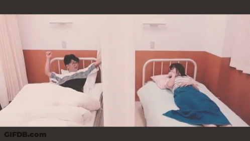 Man And Woman Laying In Hospital Beds GIF