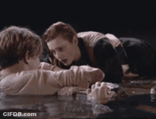 Man And Woman Laying In Water GIF