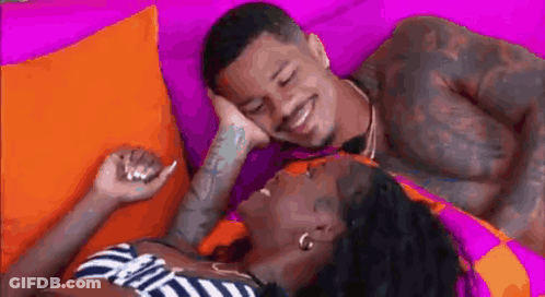 Man And Woman Laying Next To Each Other On Couch GIF