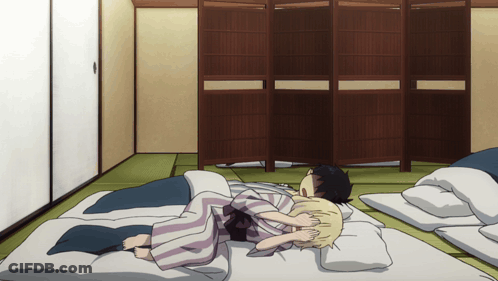 Man And Woman Laying On Bed GIF