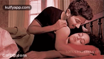 Man And Woman Laying On Bed GIF