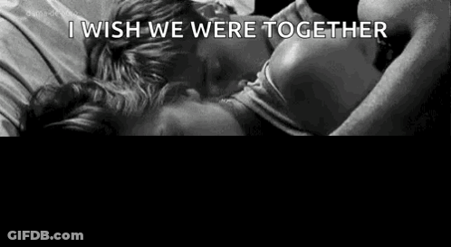 Man And Woman Laying On Bed Holding Hands GIF