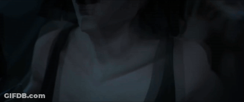 Man And Woman Laying On Bed In Dark GIF