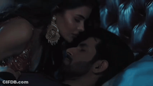 Man And Woman Laying On Bed GIF