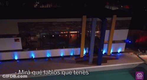 Man And Woman Laying On Bed With Mira Que Labios Que Tenes GIF