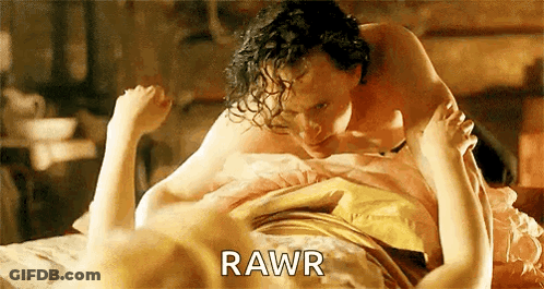 Man And Woman Laying On Bed With Rawr GIF
