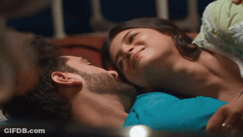 Man And Woman Laying On Bed Woman Smiling GIF